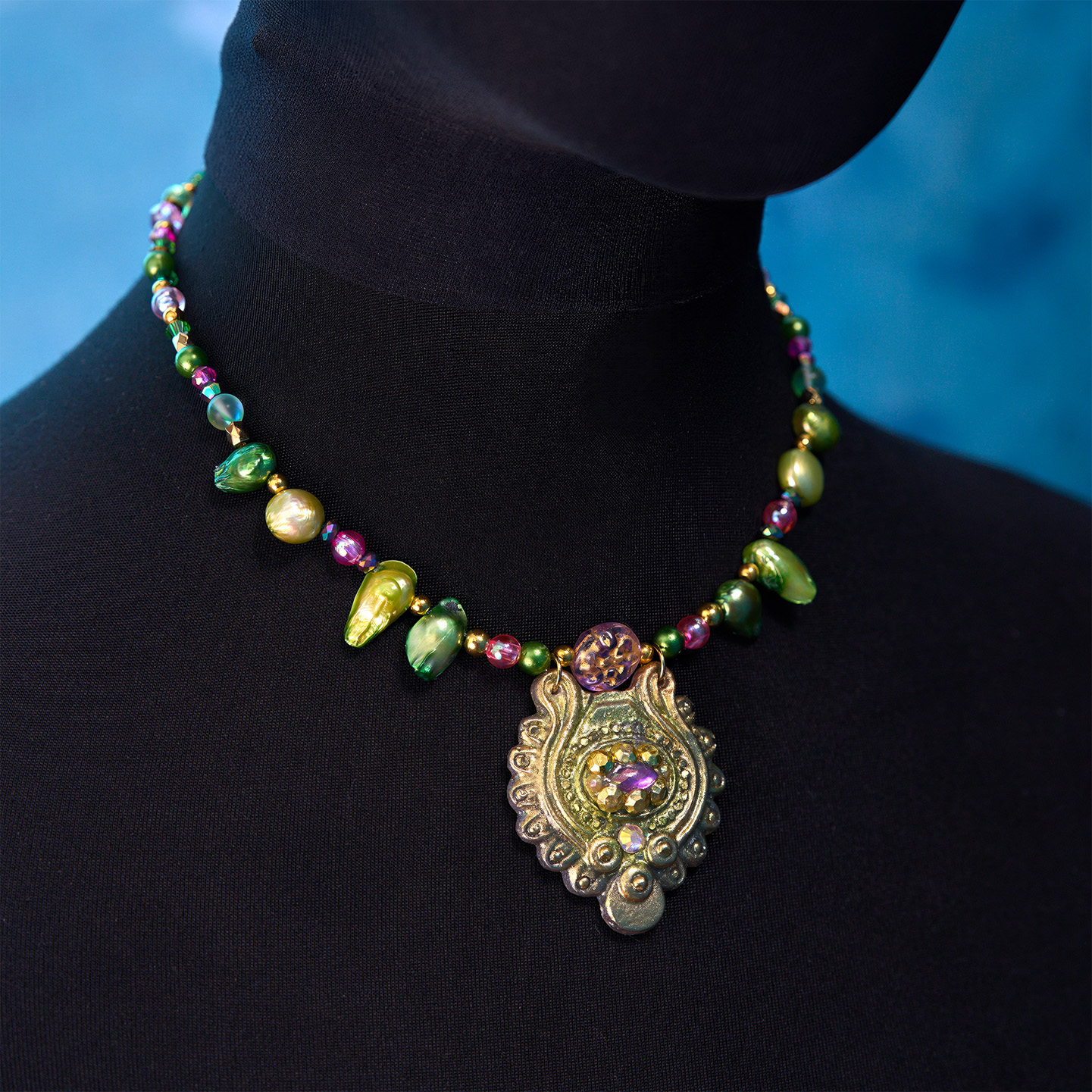 Ariestasia sculptural necklace with shell, beadwork and ornamental detailing
